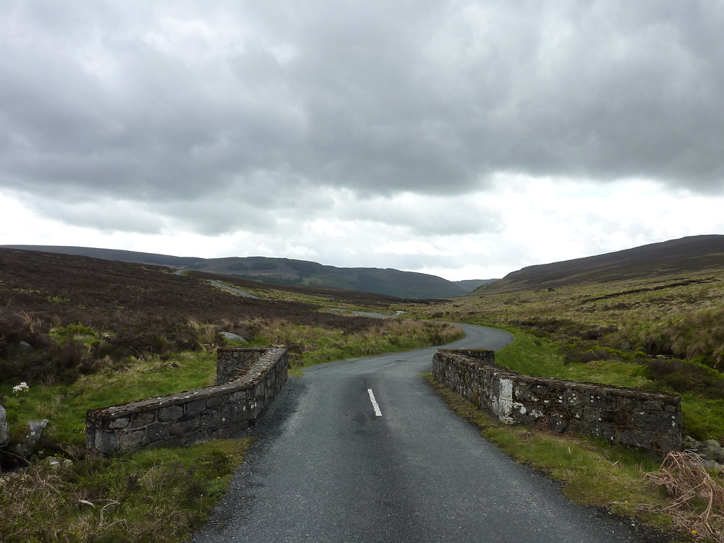 Quiet country road winding through the Irish uplands